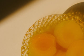 Bowl of apricots in syrup. Apricots contain ethyl acetate.