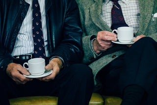 Two old mean enjoying decaf coffee